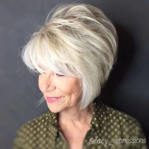 Blonde Feathered Bob with Height on the Crown hair